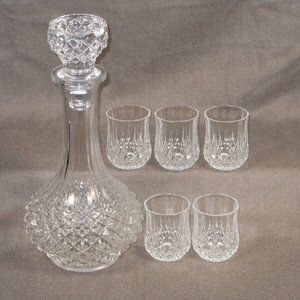 set of crystal wine bottle and 5 shot glasses